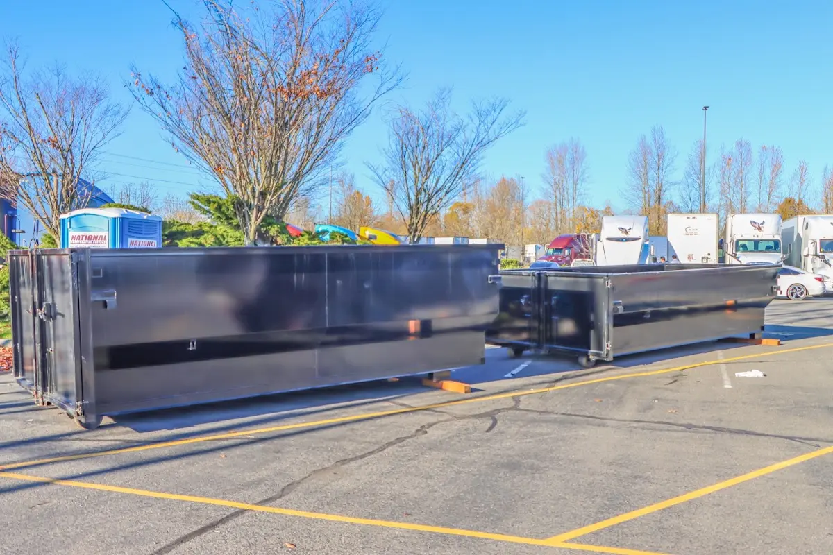 Professional dumpster rental service with roll-off container on residential driveway in Gas City